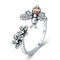 Bague abeille et fleur en argent.