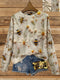 Sweat-shirt de couleur crème avec un motif de bourdons et de marguerites.