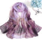 Echarpe en soie transparente aux couleurs dégradées de violet et de mauve.