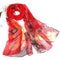 Foulard en soie rouge avec des motifs floraux de style aquarelle dans les tons bruns et jaunes.
