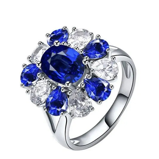 Bague en argent avec des pierres bleues et blanches.