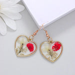 Boucles d’Oreilles Fleur Séchée Cœur Résine - Vignette | Dame Fleur