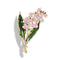 Broche décorative en forme de muguet avec des fleurs en émail rose, des feuilles vertes et des accents en cristal.