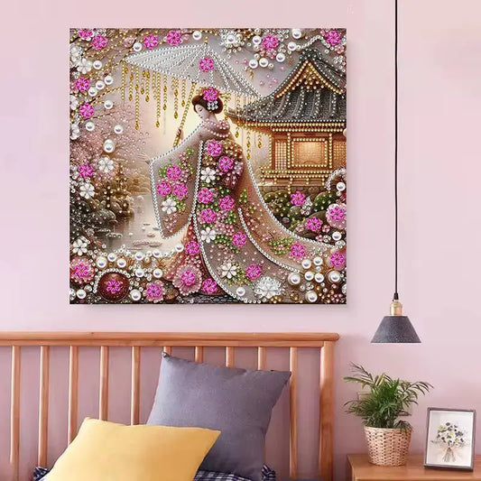 Art mural décoratif représentant une scène de style japonais avec des cerisiers en fleurs, une pagode et un personnage en kimono au milieu d’accents roses et dorés.